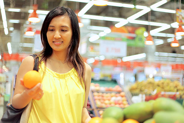 istock Woman Holding An Orange 535223961