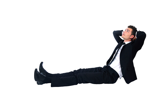Isolated business man relaxing on white