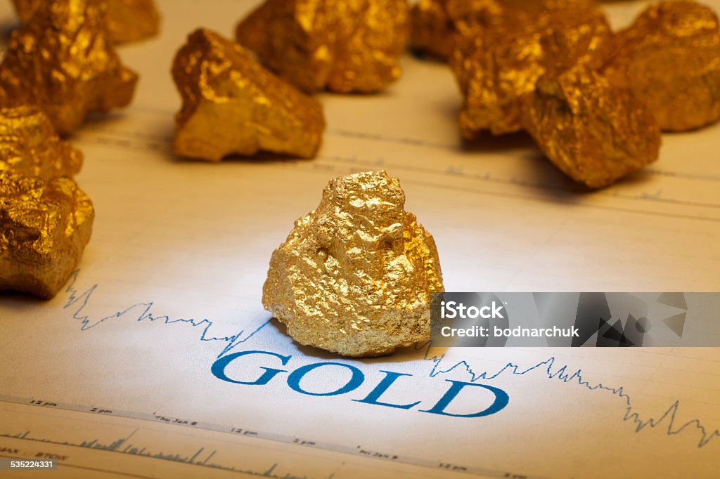 nugget gold Closeup of big gold nugget Nugget Stock Photo