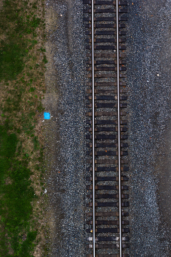 Aerial view of straight train tracks.