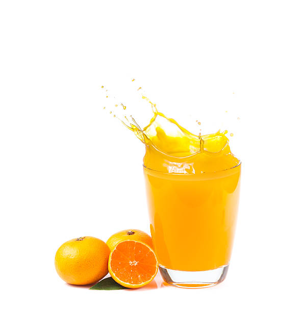 istock splashing orange juice with oranges against 535225853