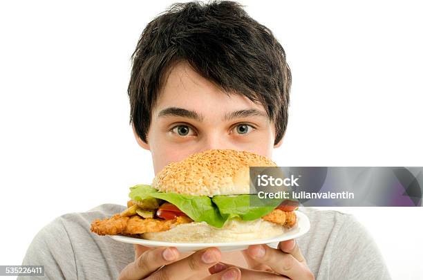 Man With Black Tape On Mouth Unable To Eat Hamburger Stock Photo - Download Image Now