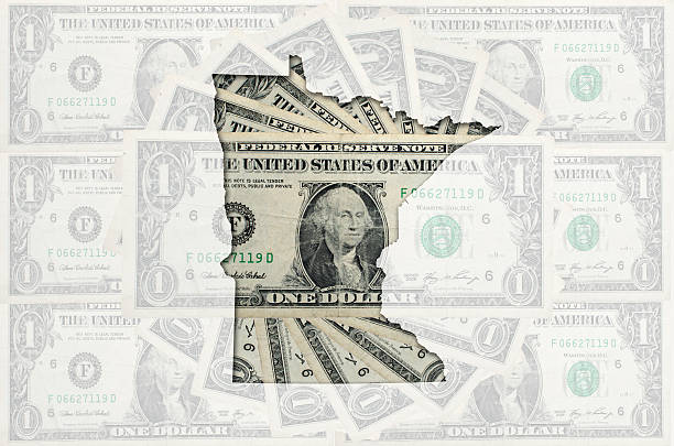 Outline map of minnesota with transparent american dollar banknotes stock photo
