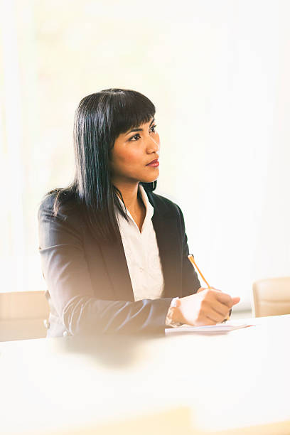 istock Businesswoman taking notes at a meeting 535234024