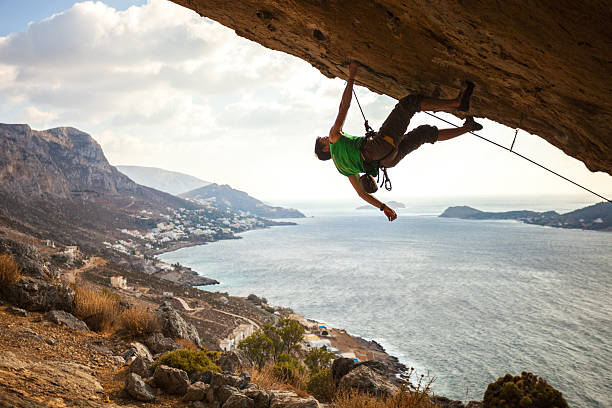 istock Male climber climbing overhanging rock 535239155