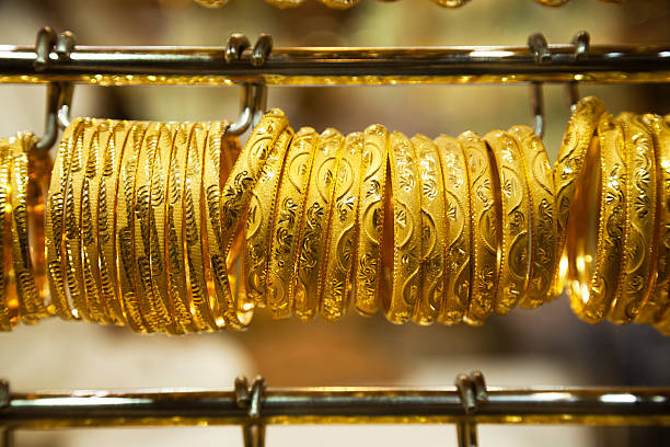 istock gold bracelet hanging on a display 535239164