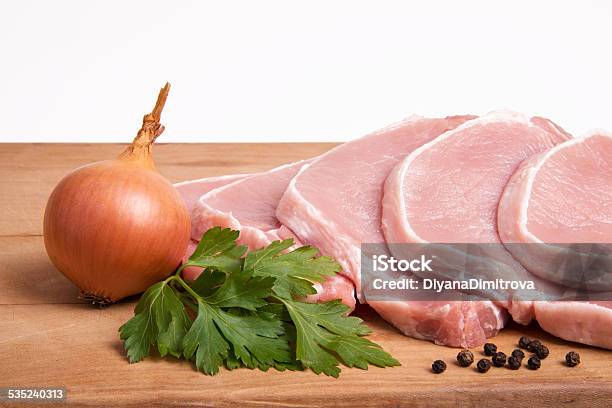 Raw Pork Meat Vegetables And Spices Arranged On Kitchen Board Stock Photo - Download Image Now