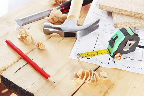 istock Working tools of carpenter lie on the wooden workbench 535240599