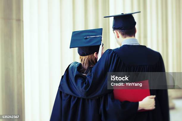Student Couple In University Graduation Vertical Stock Photo - Download Image Now - 20-24 Years, 20-29 Years, 2015
