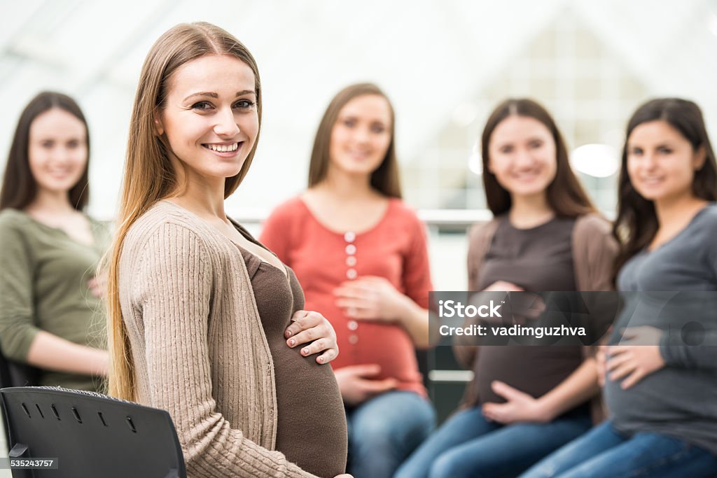 Pregnant women Happy pregnant women are talking together at antenatal class at the hospital. Pregnant Stock Photo