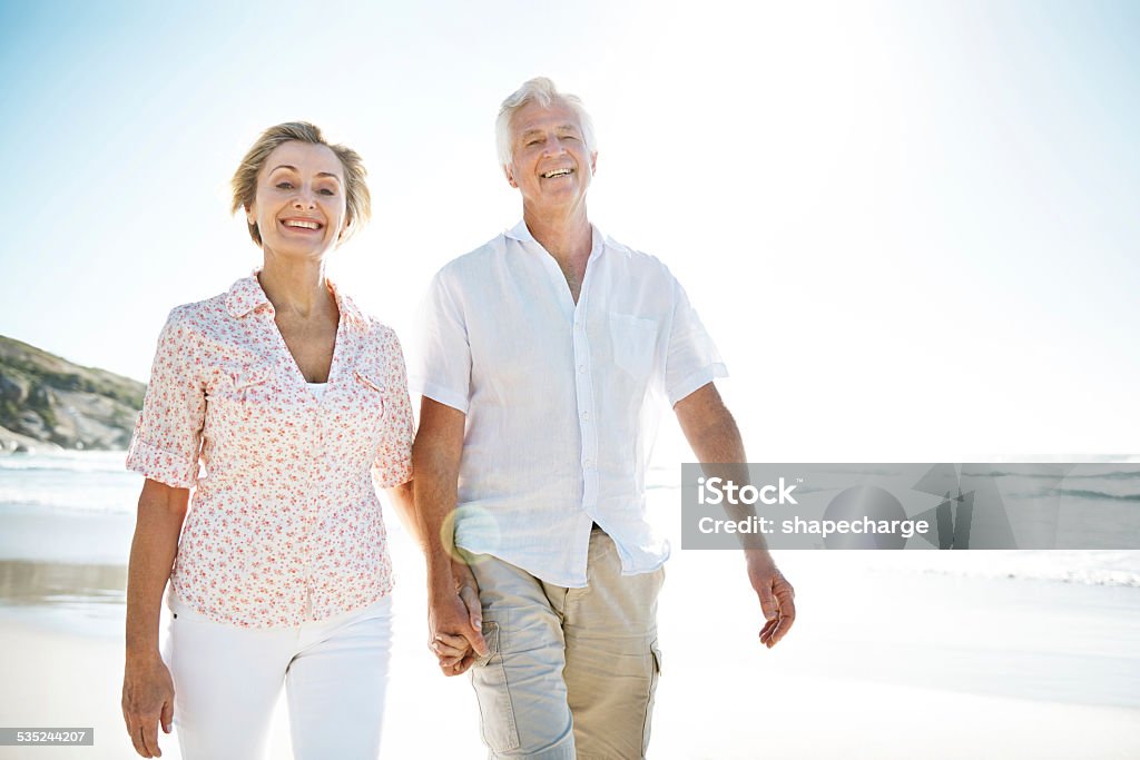 All you need is love A senior couple walking hand-in-hand on the beachhttp://195.154.178.81/DATA/istock_collage/0/shoots/785025.jpg Holding Hands Stock Photo
