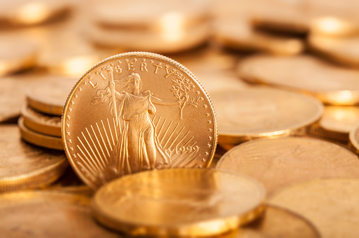 American Gold coins photographed with a short depth of field.