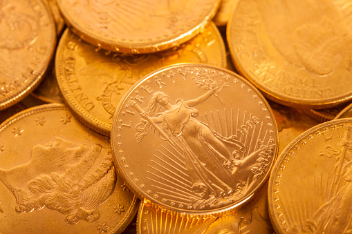 American Gold coins photographed with a short depth of field.