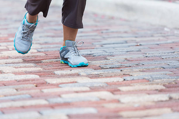 istock Feet walking on brick road 535260041
