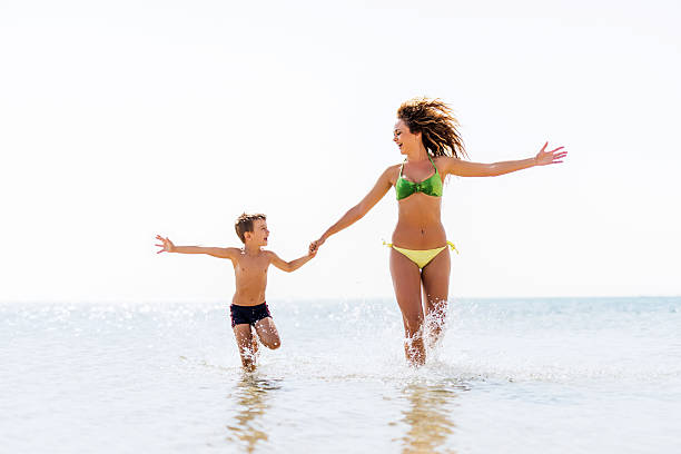 istock Cheerful mother and son at sea. 535260575