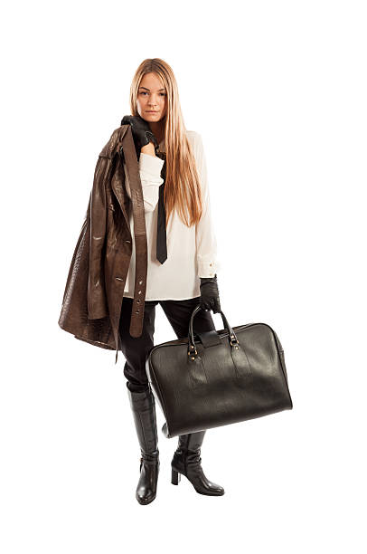 istock Female model with leather jacket and black handbag posing 535260897