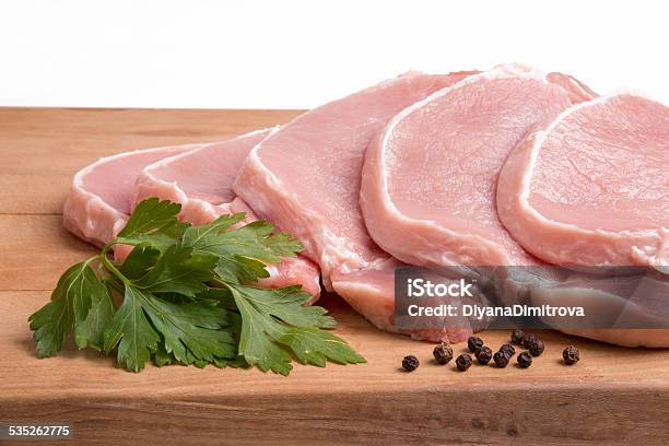 Raw Pork Meat Vegetables And Spices Arranged On Kitchen Board Stock Photo - Download Image Now