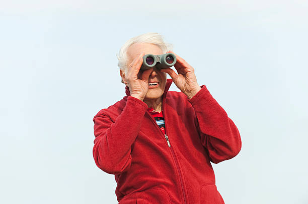 istock Germany, St.Peter-Ording, North Sea, Senior man looking through binoculars 535266021