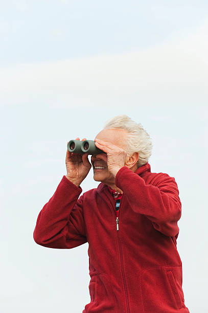 istock Germany, St.Peter-Ording, North Sea, Senior man looking through binoculars 535266023