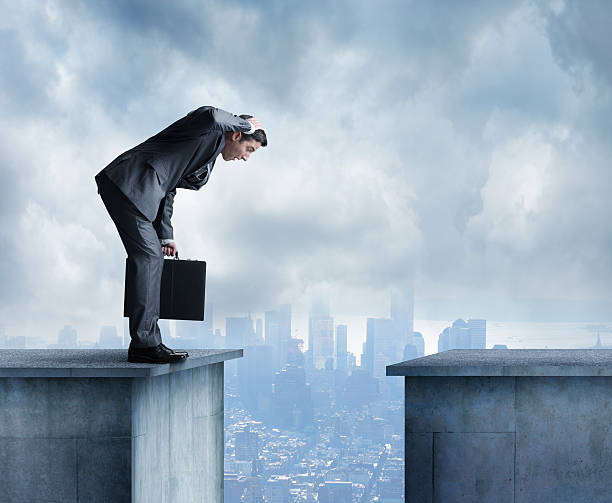 istock Man in a suit stares at space between two buildings 535267781