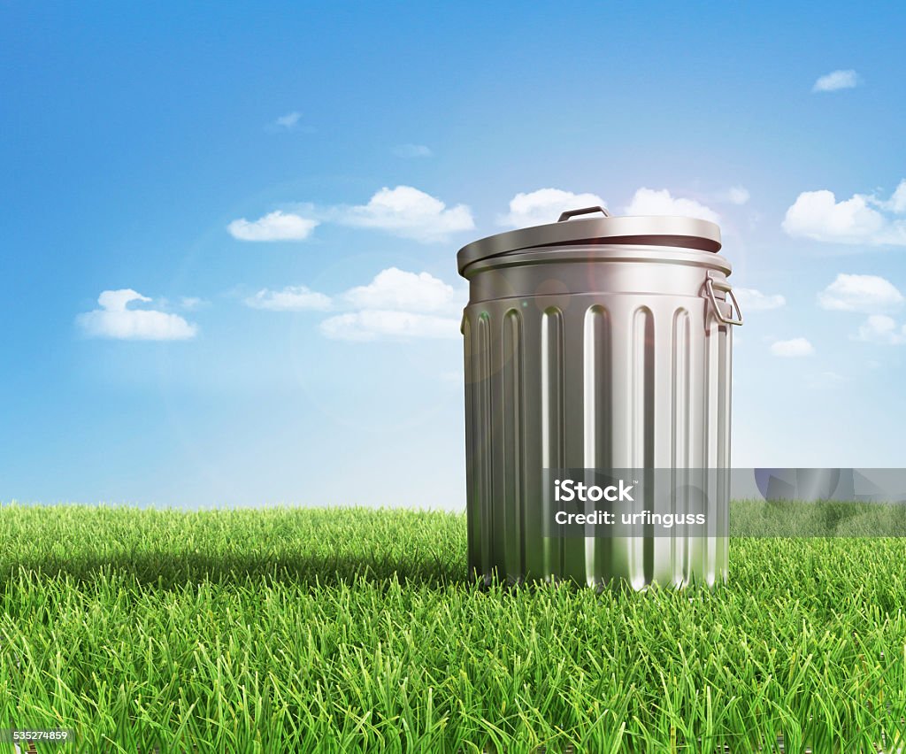 Green plastic trash recycling container ecology concept, with landscape background. 2015 Stock Photo