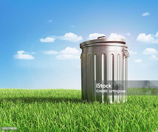 Green Plastic Trash Recycling Container Ecology Concept With Landscape Background Stock Photo - Download Image Now