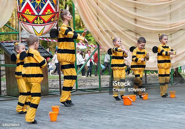 Young Children With The Teacher On Stage In Costume Bee Stock Photo - Download Image Now