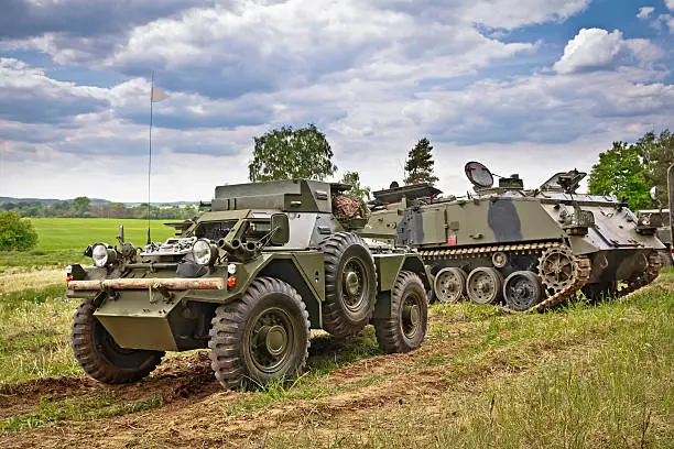 British light fast 4WD reconnaissance vehicle - The Daimler "Dingo" Scout Car and AFV 434 tracked armoured transport vehicle on the military training area