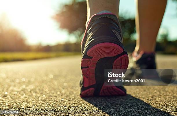 Woman Running Stock Photo - Download Image Now - Asphalt, Walking, 2015