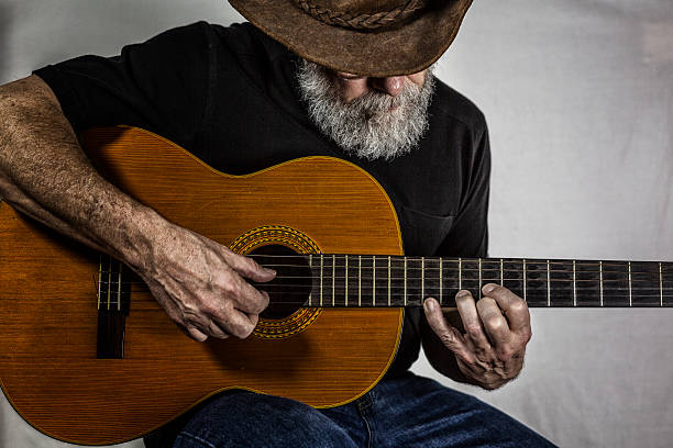 Senior Man Playing Acoustic Guitar