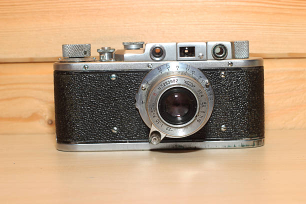 istock Vintage camera on a wooden background. 535294009