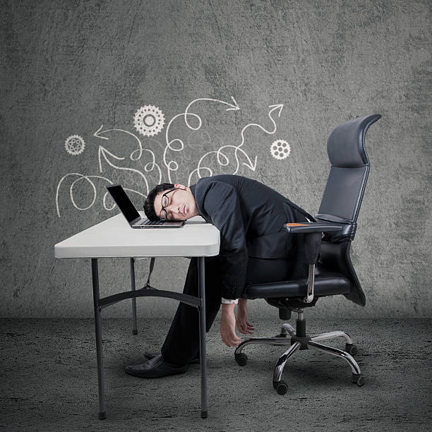 istock Frustrated manager sleeping on laptop at desk 535295281