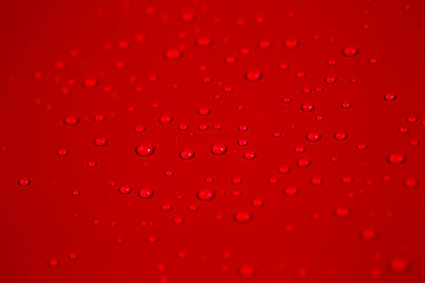 istock Drops of water on red background 535296497