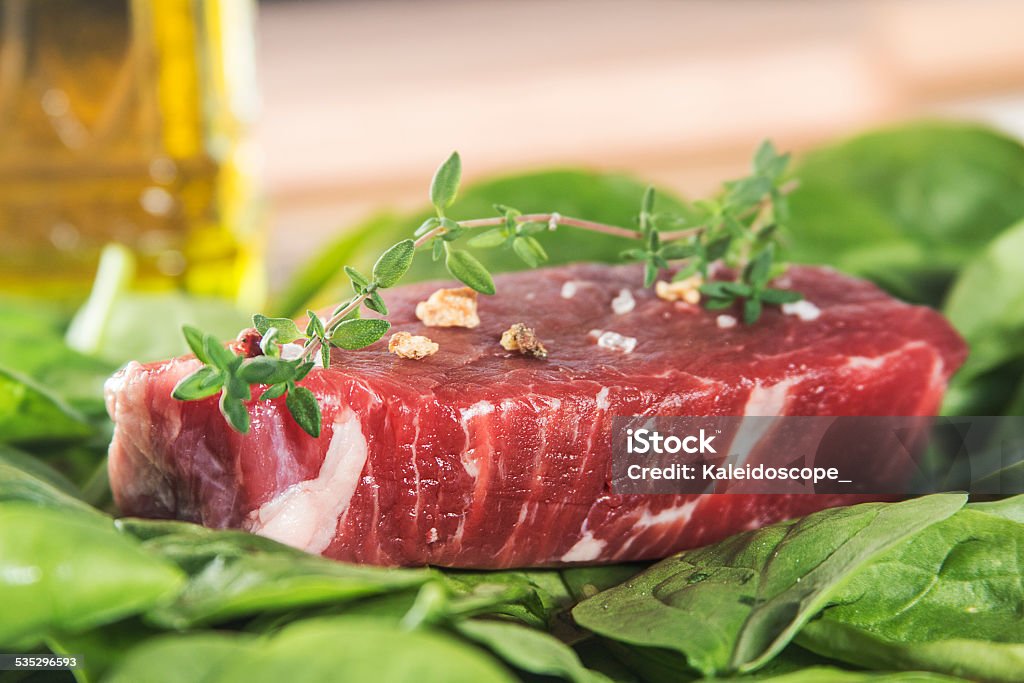 Raw beef tenderloin with spices with vegetables 2015 Stock Photo