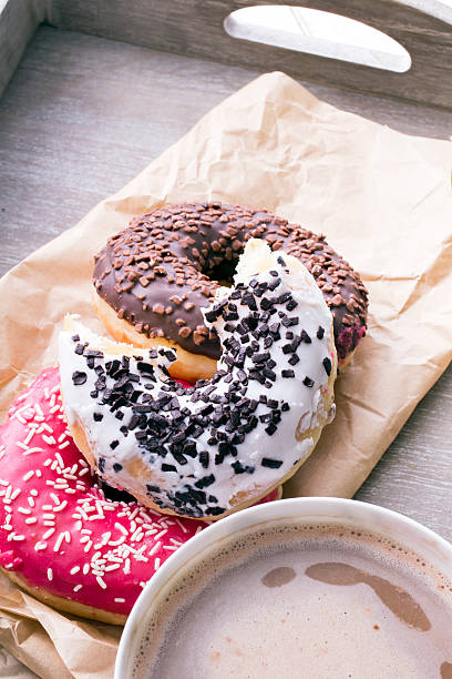 istock coffee and donut on wood background 535296873