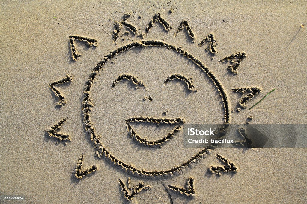 smiling sun in the beach a drawing seen in jesolo beach Drawing - Activity Stock Photo