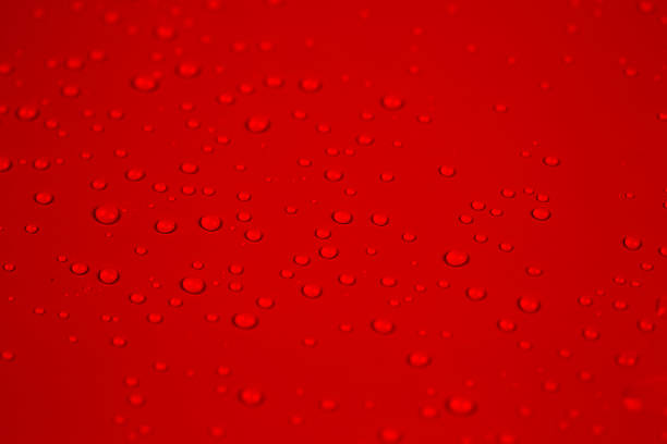 istock Drops of water on red background 535297167