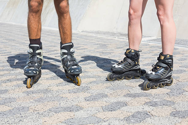 istock Fit couple rollerblading together on the promenade 535299057