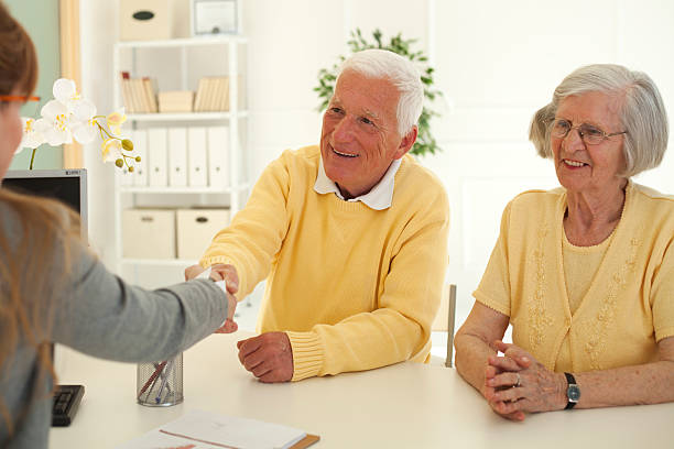 istock Senior couple with consultant. 535299213