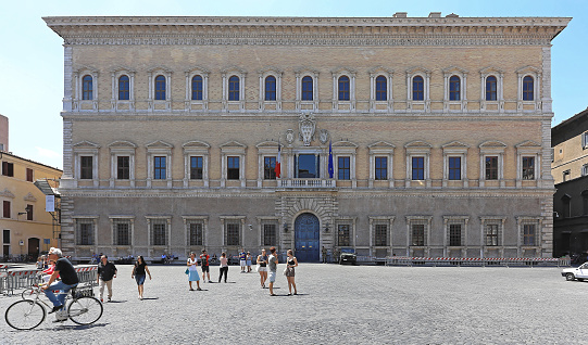 Rome, Italy - June 29, 2014: French Embassy at Farnese Square with tourist people looking around in Rome, Italy.
