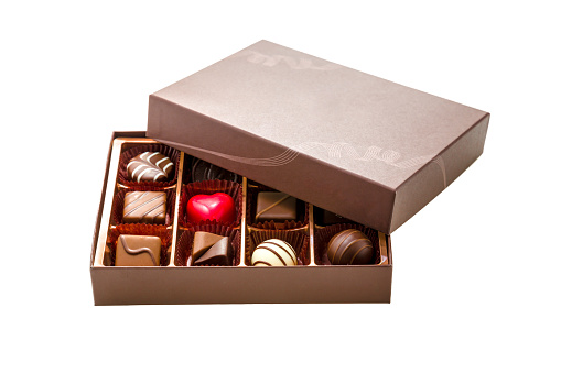 Assorted chocolates in brown box, with lid half off