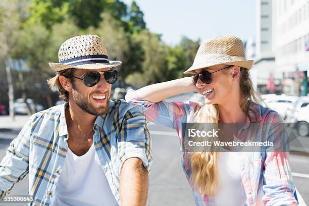 Attractive Happy Couple Wearing Sunglasses Stock Photo - Download Image Now - 20-24 Years, 20-29 Years, 2015