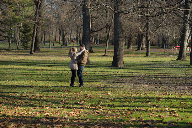 istock Happy young couple in the park 535300705