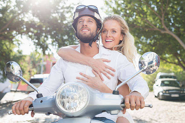 istock Attractive couple with their scooter 535301093