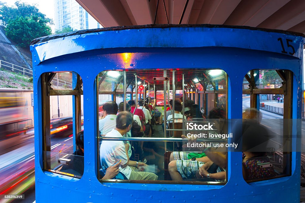 double-decker bus on the road Hongkong, Сhina - August 1, 2012: double-decker bus driving on the modern city,Hongkong,The bus has been regarded as the feature of Hongkong to the tourists.  2015 Stock Photo