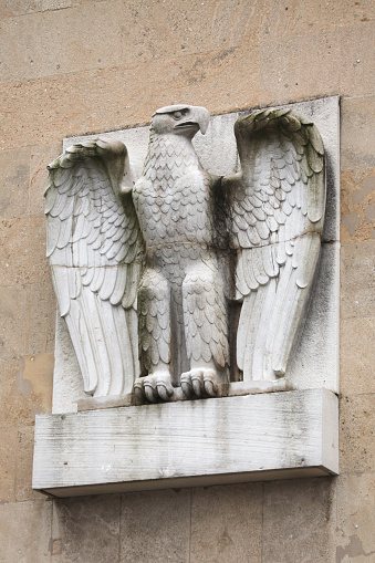 Berlin, Germany - January 6, 2015: German Eagle from the 1930s on the main building of the Tempelhof Airport in Berlin, Germany.