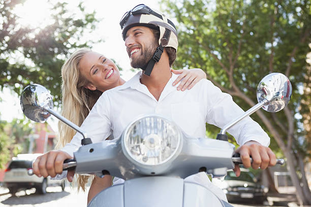 istock Cute couple riding a scooter 535317505