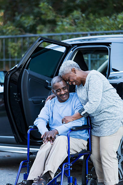 istock Disabled senior man in wheelchair with his devoted wife 535317857