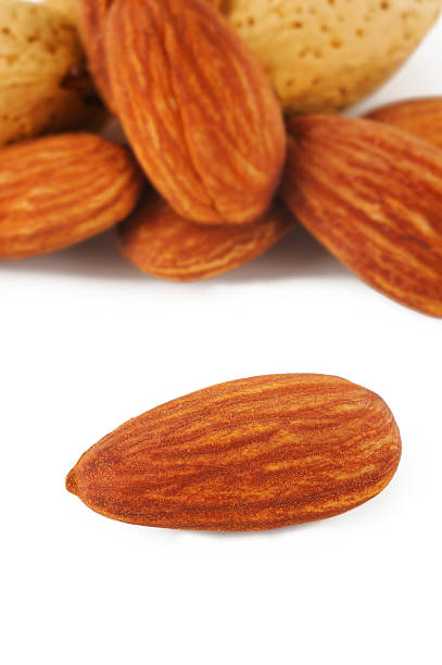 istock closeup almond on white background 535318229