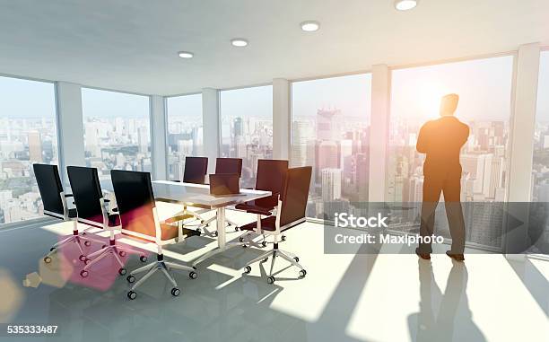 Businessman Looking Outside Window Thinking About Opportunities Stock Photo - Download Image Now